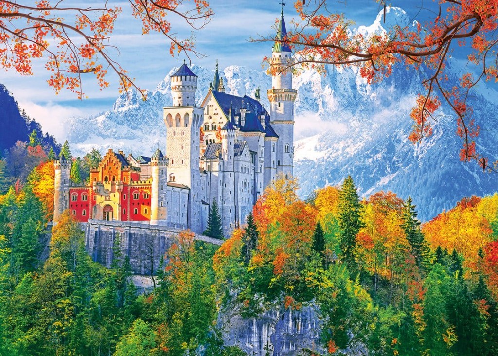 “Neuschwanstein Castle in Bavaria Germany surrounded by autumn foliage”